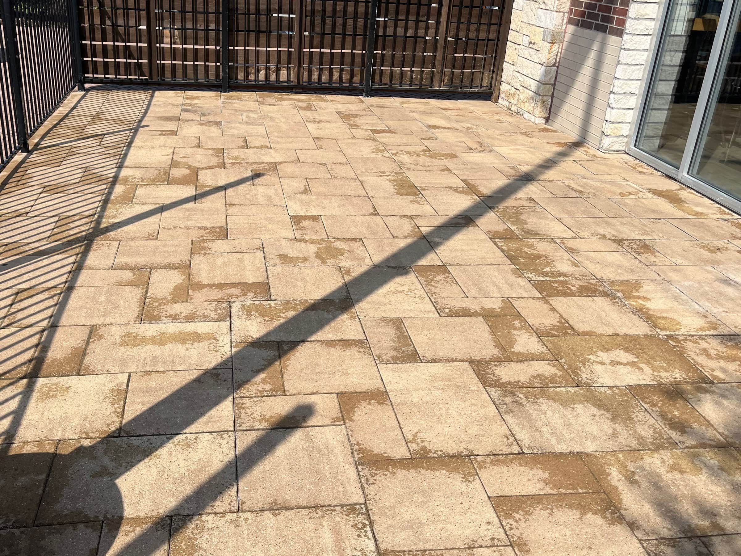 The same restaurant paver patio after pressure washing, the pavers back to their original warm tan.